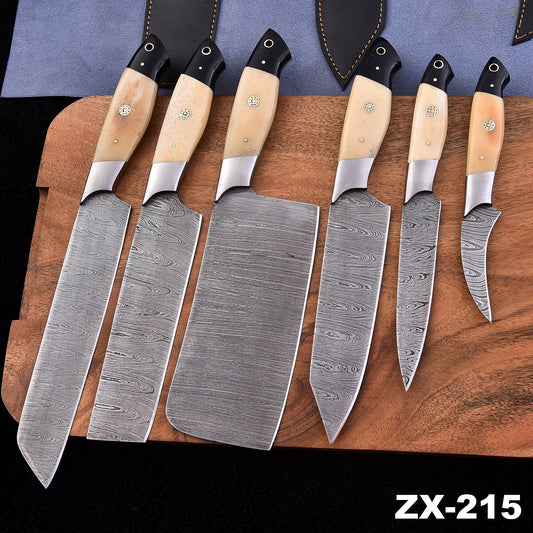 Seven kitchen knives with patterned Damascus steel blades and light-colored wooden handles are arranged on a wooden cutting board, with a black sheath behind them. The text 'ZX-215' appears in the bottom right corner.