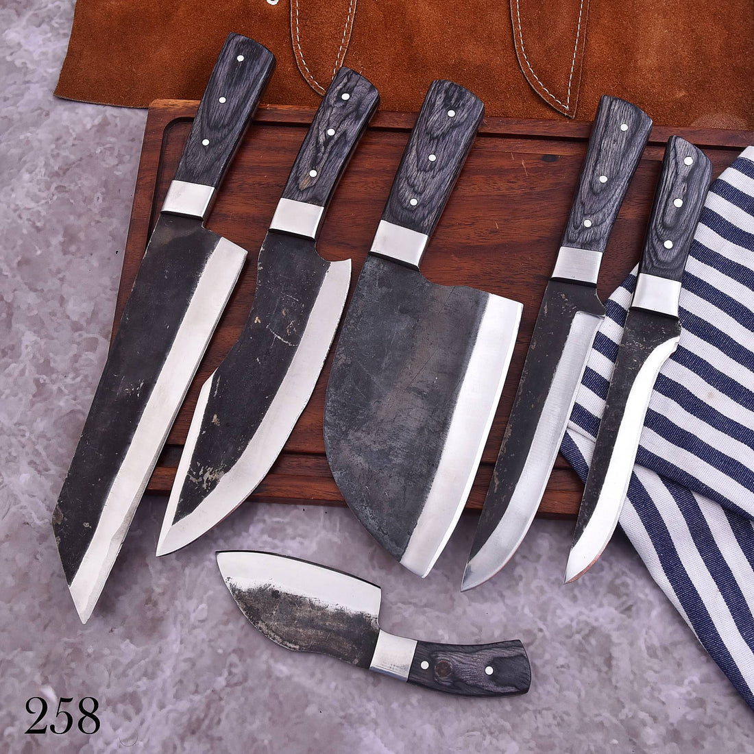 Six kitchen knives arranged together for an online knife-set comparison guide