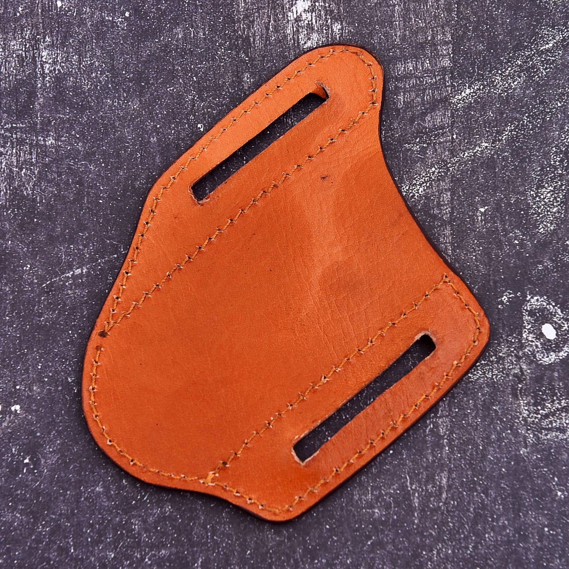 Handmade brown leather pocket knife sheath with embossed feather pattern