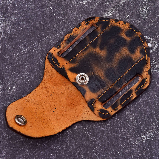 Custom leather knife sheath with brown black finish, snap button, and stitched belt pouch design