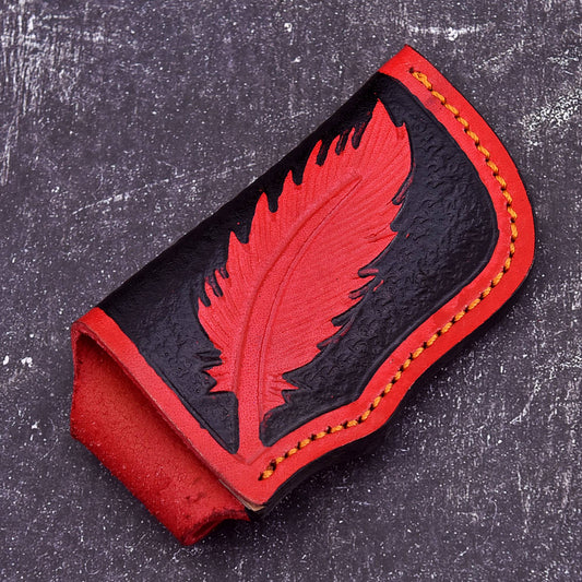 Handmade red and black leather knife sheath with feather embossed design and stitched edges