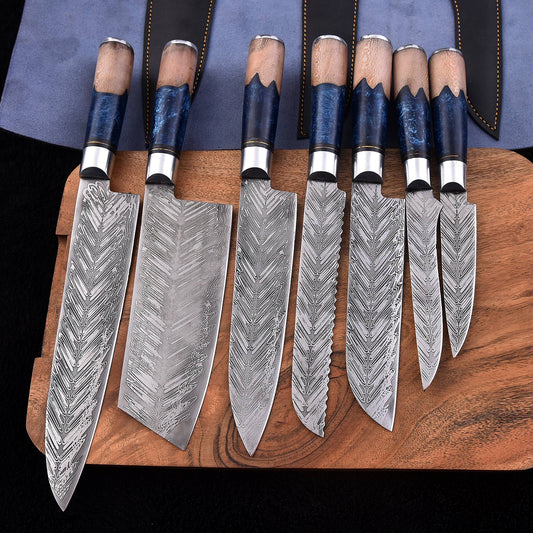 Seven-piece handmade Damascus chef knife set with blue resin and natural wood handles displayed on a wooden board