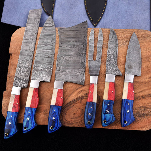 Six-piece handmade Damascus BBQ knife set with red white and blue Texas flag handles, cleaver and carving fork